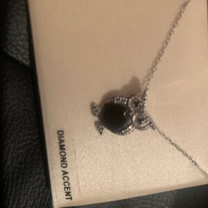 925 sterling silver owl and 18 inch‎ chain. Owl has diamond accents